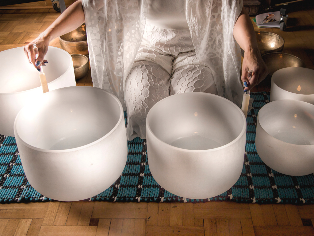 a set of clear white singing bowls